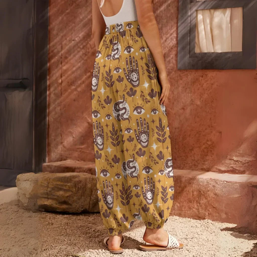 Yellow patterned harem pants with hamsa and floral motifs, back view - RETRO MYSTIC HAREM PANTS WOMEN FOR YOGA & COMFORT