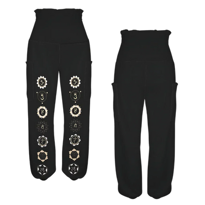 Black harem pants with decorative white circular patterns down the legs, front-back view - BLACK ALADDIN PANTS FOR LADIES WITH CHAKRA PRINT