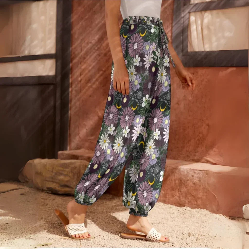 Floral print harem pants with an elastic ankle cuff, side view - BOHEMIAN FLOWER PLANCHETTE HAREM PANTS WOMEN