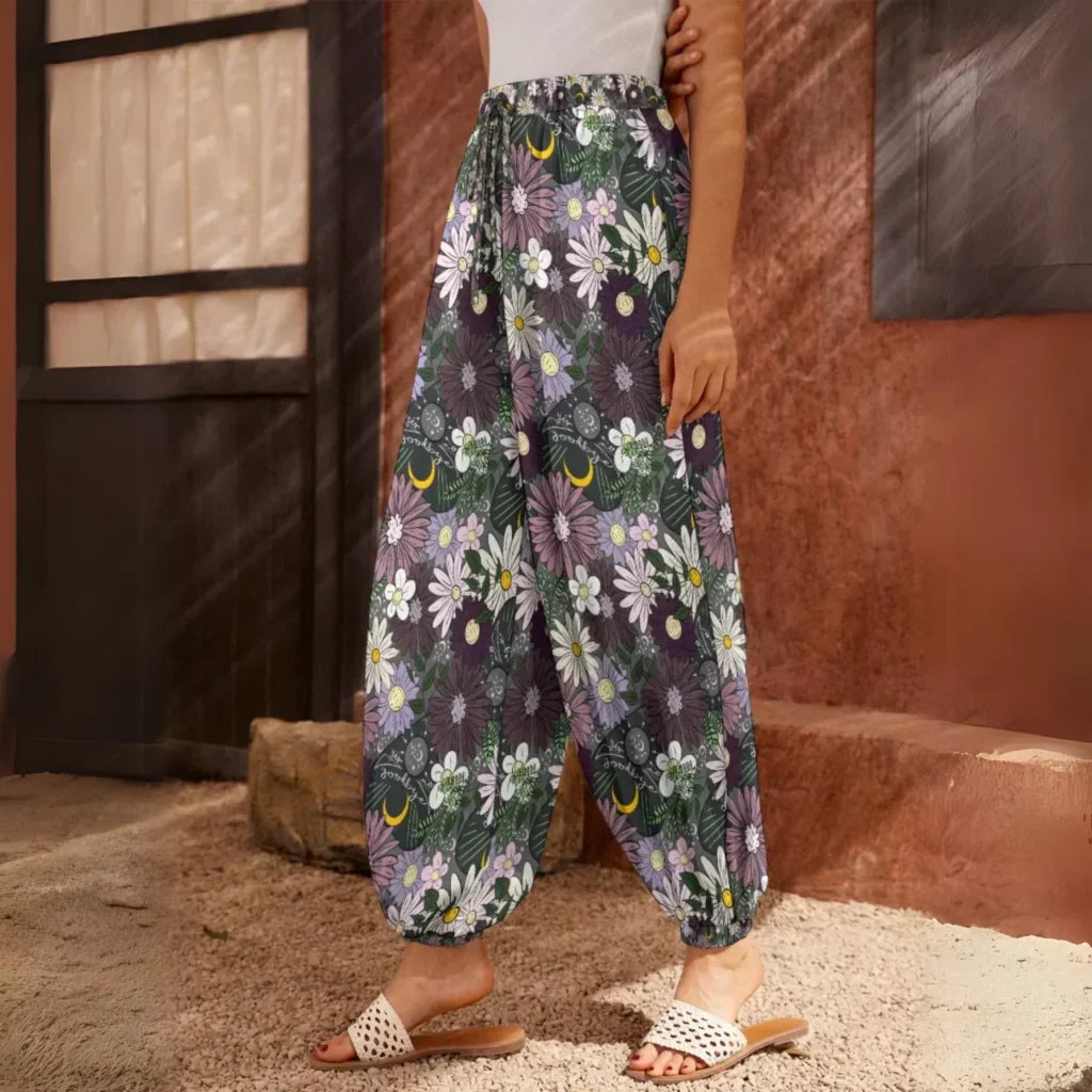 Floral print harem pants with an elastic ankle cuff, side view - BOHEMIAN FLOWER PLANCHETTE HAREM PANTS WOMEN