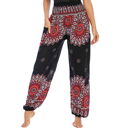 Colorful bohemian-style harem pants with peacock feather and geometric patterns, black colored, front view - BOHO SMOCKED ALADDIN PANTS FOR LADIES