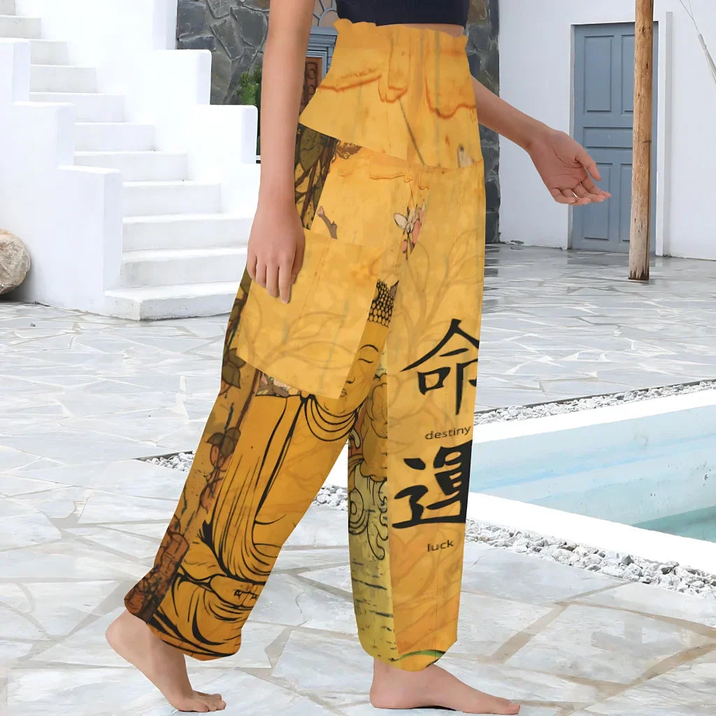 Yellow harem pants featuring a Buddha design and Chinese characters, side view - BUDDHA SAKURA BLOSSOM ALADDIN PANTS FOR LADIES