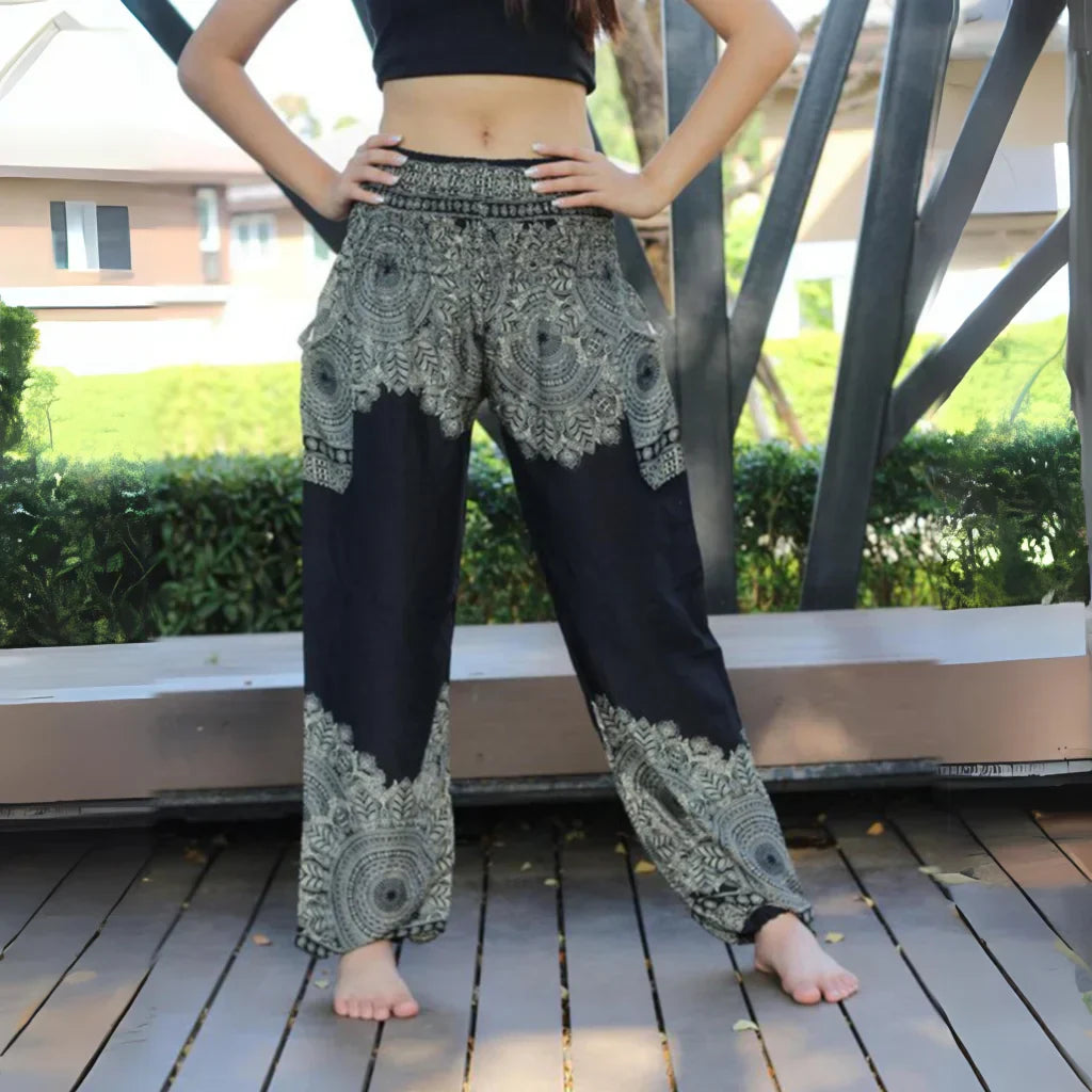 Black and white patterned harem pants with a mandala design, front view - DIGITAL PRINTED BOHO SMOCKED ALADDIN PANTS FOR LADIES - Style F / One size