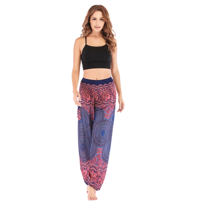 Patterned harem pants with a mandala print in Purple, Blue and pink paired with a black crop top, front view - ETHNIC PRINT SMOCKED ALADDIN PANTS FOR LADIES