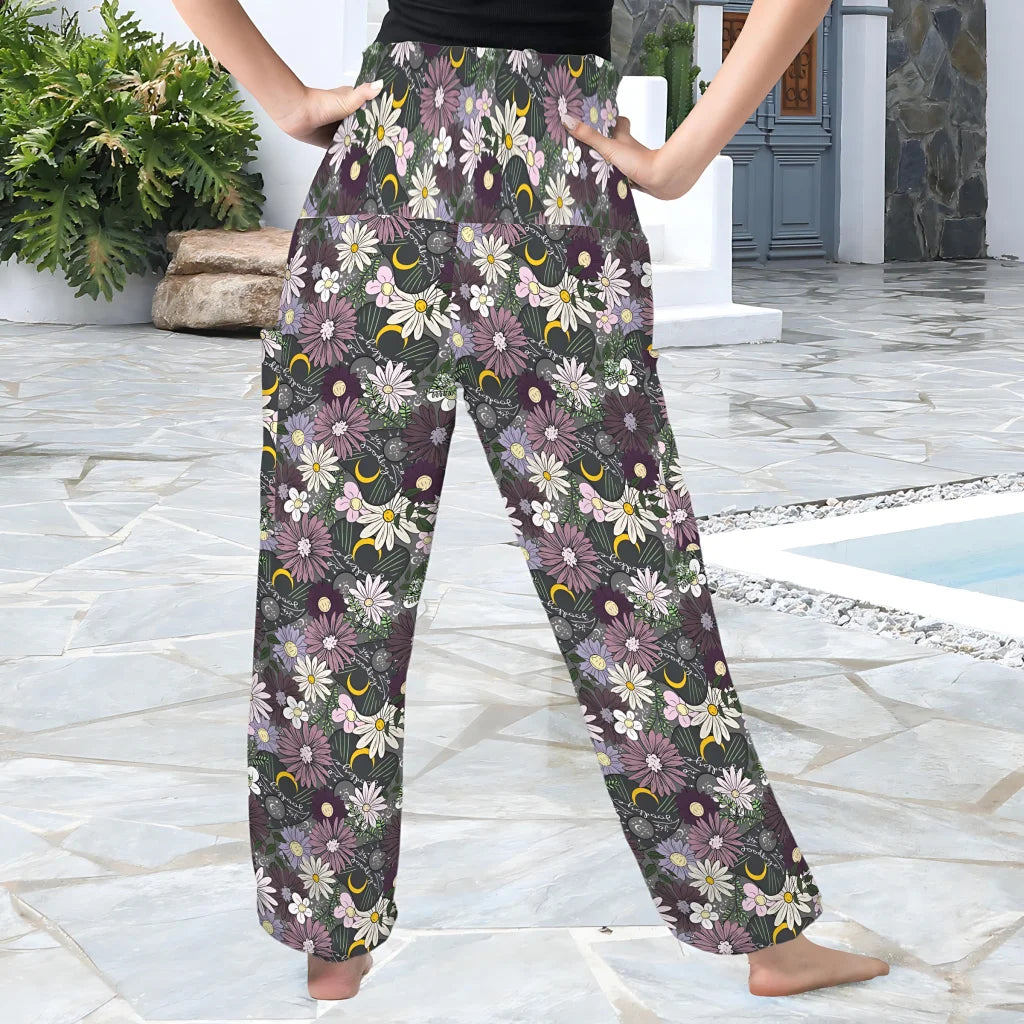 Floral print palazzo pants with a dark background and daisy pattern, back view - FLOWER PLANCHETTE ALADDIN PANTS FOR LADIES