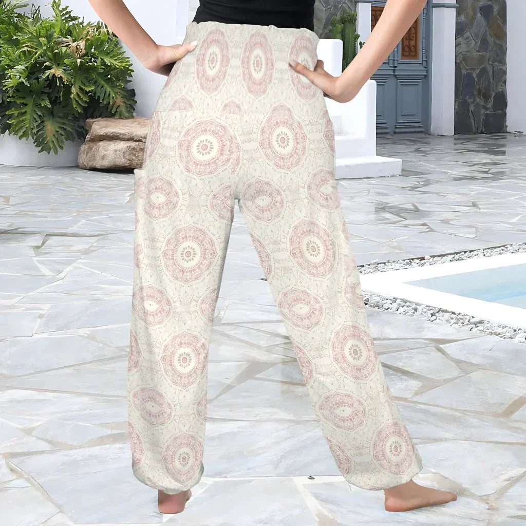 High-waisted palazzo pants with a circular mandala-style print pattern in beige and pink tones, back view - MANDALA PATTERN ALADDIN PANTS FOR LADIES