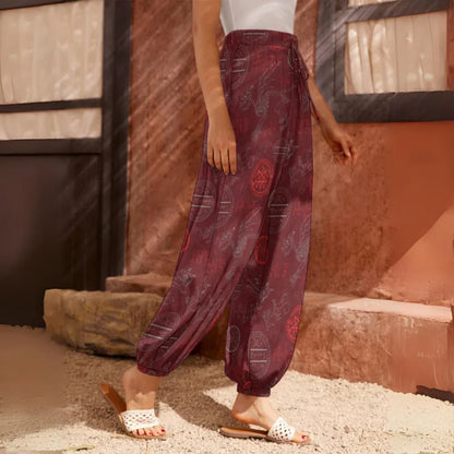 Burgundy harem pants with floral print pattern and elastic cuffs at the ankles, side view - MYSTIC DRAGON SKELETON HAREM PANTS WOMEN