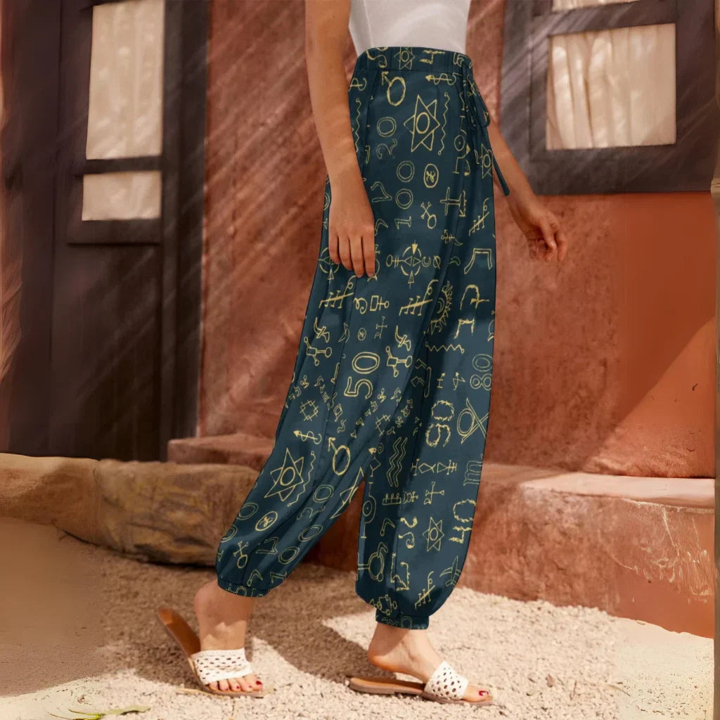 Teal harem pants with golden geometric sacred symbols print pattern, side view - MYSTICAL HAREM PANTS WOMEN WITH SACRED SYMBOLS