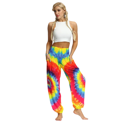 Vibrant tie-dye harem pants with elastic cuffs paired with a white crop top, front view - TIE DYE SMOCKED ALADDIN PANTS FOR LADIES FOR YOGA & FESTIVALS - Style A / Average Size