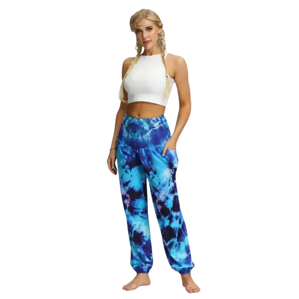 Vibrant tie-dye blue harem pants with elastic cuffs paired with a white crop top, front view - TIE DYE SMOCKED ALADDIN PANTS FOR LADIES FOR YOGA & FESTIVALS - Style A / Average Size