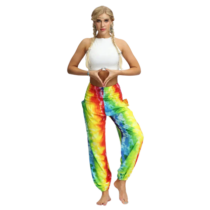 Vibrant tie-dye yellow-red harem pants with elastic cuffs paired with a white crop top, front view - TIE DYE SMOCKED ALADDIN PANTS FOR LADIES FOR YOGA & FESTIVALS - Style A / Average Size