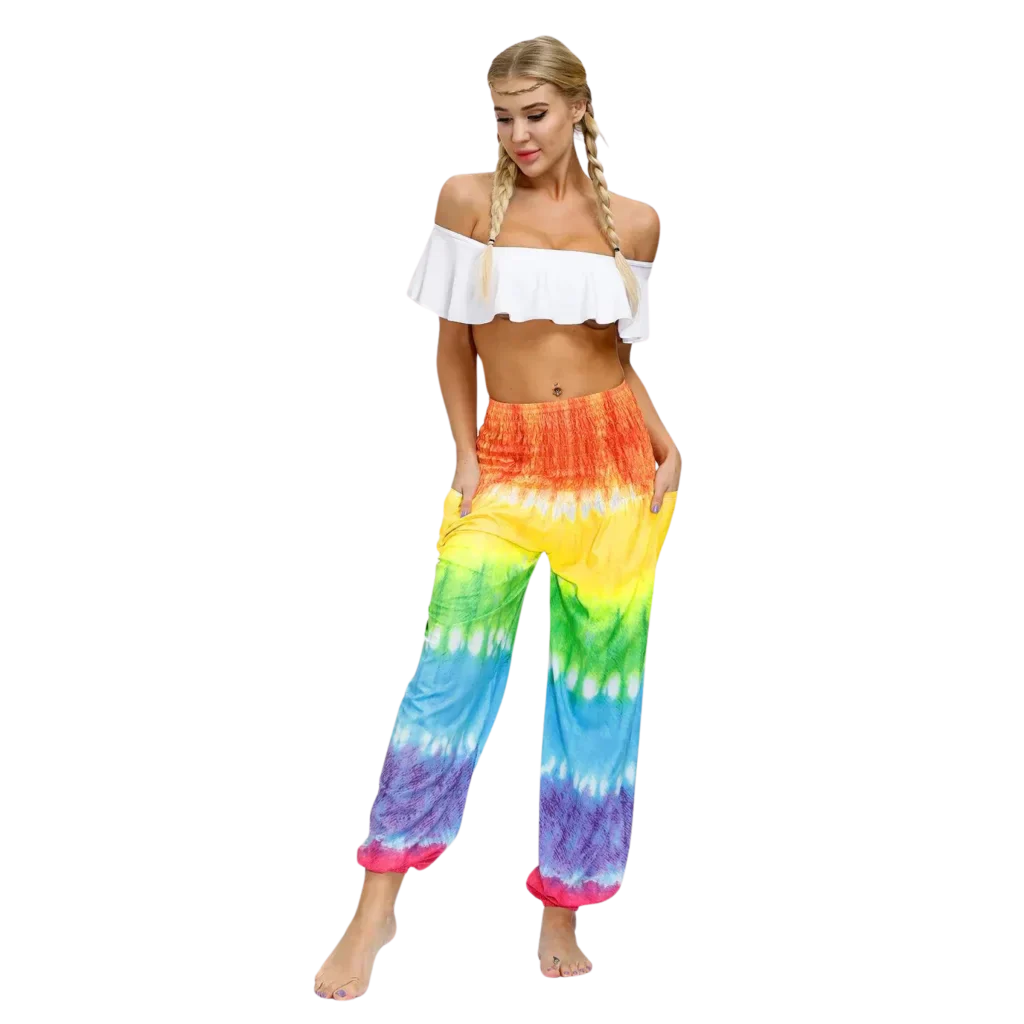 Vibrant tie-dye yellow-red harem pants with elastic cuffs paired with a white crop top, front view - TIE DYE SMOCKED ALADDIN PANTS FOR LADIES FOR YOGA & FESTIVALS - Style A / Average Size