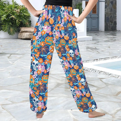 Colorful floral and skull print harem pants with an elastic waistband, back view - VIBRANT HALLOWEEN SMOCKED ALADDIN PANTS FOR LADIES